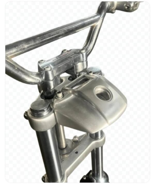 Biltwell moto bars, stock risers, stock single disk master/caliper/clutch perch off of a 2000 superglide, Chinese fork brace, racetech internals w/gold valves, stock length tubes, shorty levers, trees, headlight eyebrow.